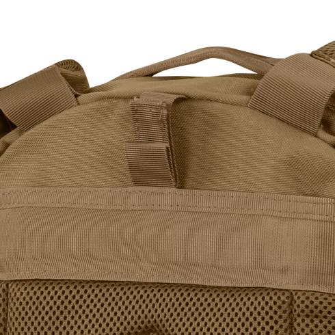 Close-up of the Condor Compact Assault Backpack Gen II 24L in tan, a top pick among military and bushcraft users, highlighting its webbing, mesh fabric, and sturdy top carrying handle.