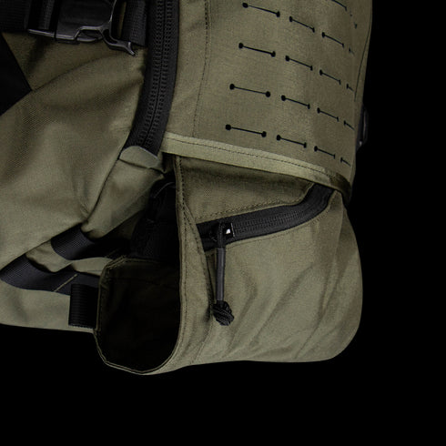 Close-up of the Condor Nomad Backpack 25L in olive green, featuring a zippered pocket, black buckle, and MOLLE-style webbing—perfect for everyday carry or first responders.