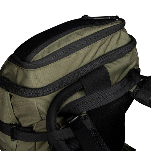 Close-up of the Condor Nomad Backpack 25L in olive green, featuring black zippers, straps, and a padded shoulder harness, set against a plain white background.