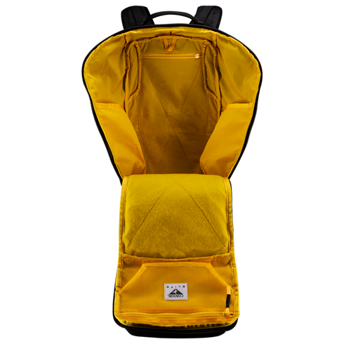The Condor Nomad Backpack 25L in yellow is shown open with visible inner compartments and pockets, displayed against a white background.