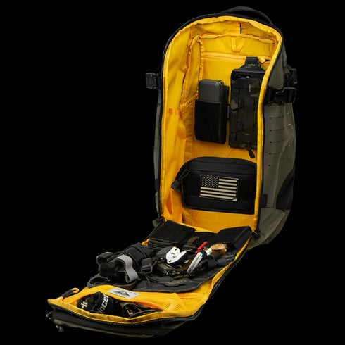 The Condor Nomad Backpack 25L is shown open, featuring a yellow interior, an American flag patch, multiple compartments, and organized EDC tools and gadgets for tactical use.