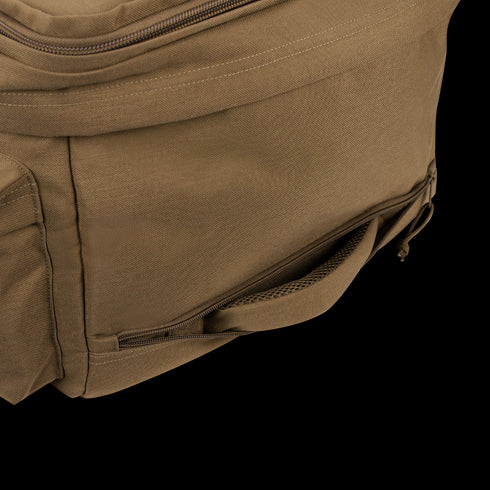 Close-up of the Condor Haul 37 Rolling Duffle in brown, featuring a front zippered pocket and mesh side pocket, shown on a white background.