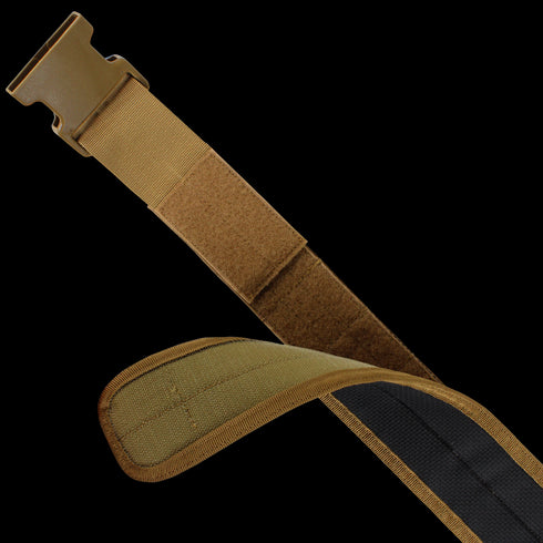 A close-up of the Condor LCS Gun Belt - MultiCam shows its tan adjustable strap with plastic buckle and Velcro fastener, partially looped and reinforced-stitched edges, designed for tactical use.