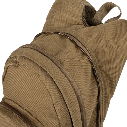 A close-up of the Condor Hydration Backpack 8L in tan canvas, featuring two zippered compartments—one partially unzipped—highlighting the top and front sections.