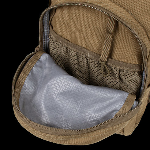 The Condor Hydration Backpack 8L in tan features a mesh pocket and gray geometric-pattern inner lining in the front compartment—perfect for first responders or law enforcement.