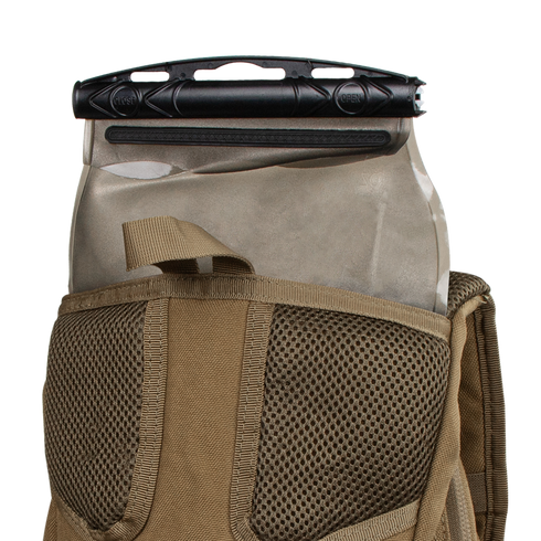 A Condor Hydration Backpack 8L in tan, featuring mesh detailing, has a tactical bladder with a black slider partially inserted into its back pocket.