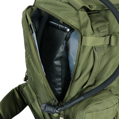 The Condor 3-Day Assault Backpack 50L in Scorpion OCP is shown open, revealing a hydration bladder and drinking hose inside—perfect for first responders or military use.