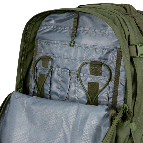 The Condor 3-Day Assault Backpack 50L opens to reveal a gray inner compartment with multiple pockets, elastic loops, and a zippered mesh section for organized storage.
