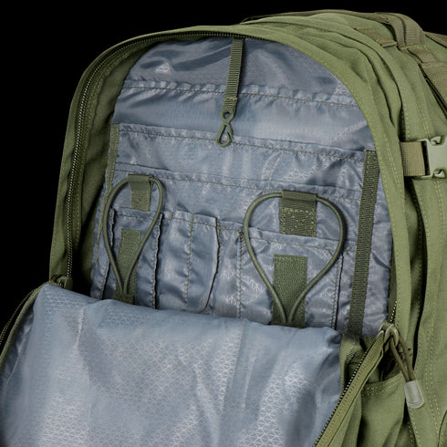 Open Condor 3-Day Assault Backpack 50L in Scorpion OCP reveals interior compartments with elastic loops, pockets, and a zippered section for organizing first responder gear.