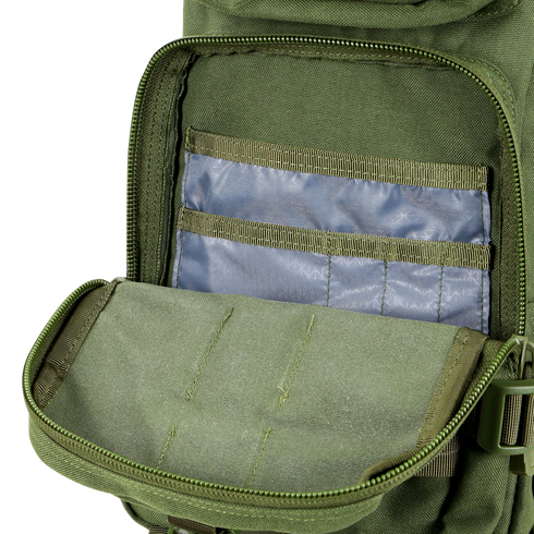 An opened Condor Compact Assault Backpack 24L in Scorpion OCP reveals an inner pocket holding several blue plastic card sleeves.
