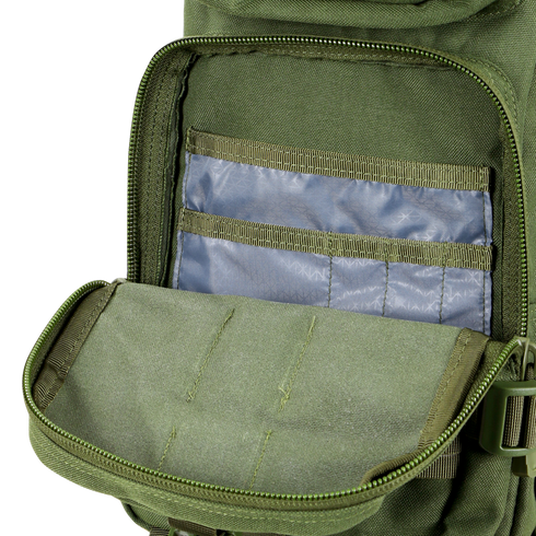 An opened Condor Compact Assault Backpack 24L in Scorpion OCP reveals an inner pocket holding several blue plastic card sleeves.