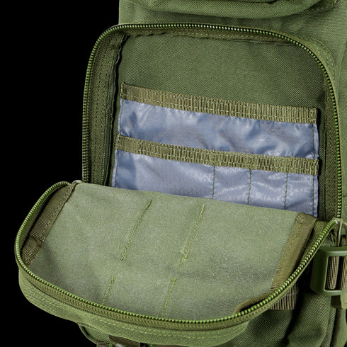 The Condor Compact Assault Backpack 24L in olive green features a tactical design with a zippered main compartment and interior pockets lined with translucent material for easy organization.