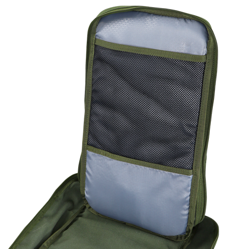 A close-up of the Condor Compact Assault Backpack 24L in green and gray, highlighting an open mesh pocket and fabric compartment inside the back panel.