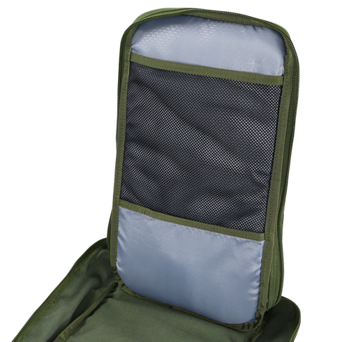 A close-up of the Condor Compact Assault Backpack 24L in green and gray, highlighting an open mesh pocket and fabric compartment inside the back panel.