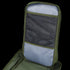 A close-up of the Condor Compact Assault Backpack 24L in green and gray, highlighting an open mesh pocket and fabric compartment inside the back panel.