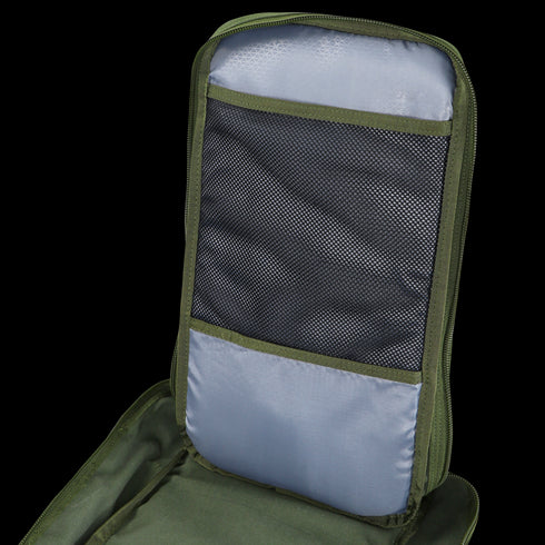 A close-up of the Condor Compact Assault Backpack 24L - Scorpion OCP shows a light grey inner pocket with black mesh and zipper, emphasizing its tactical camouflage design.