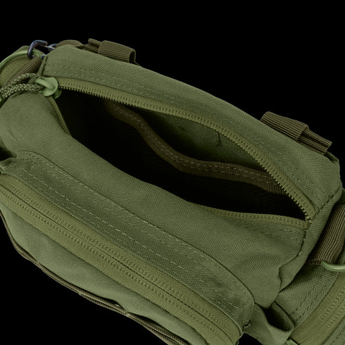 The Condor Deployment Bag 6.5L in olive green is shown open, displaying its zippered main compartment with an empty interior and extra pockets.
