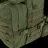 Close-up of the Condor Medium Assault Backpack 30L in green, featuring multiple webbing straps, zippers, and a plastic buckle—ideal for outdoor or military use.
