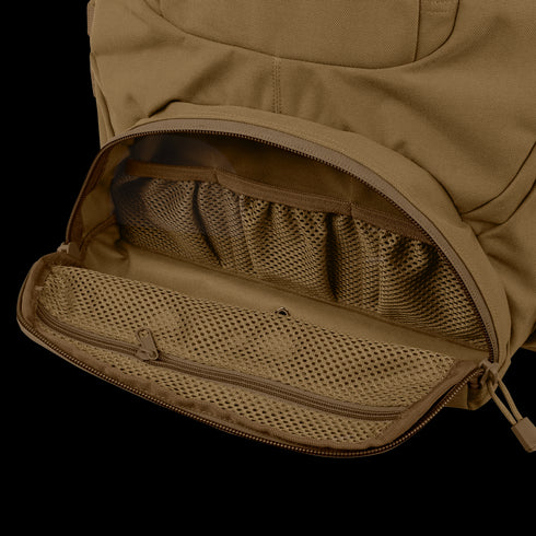 A close-up of the Condor Urban Go Backpack 33L showcases its open brown pocket with mesh organizer compartments and a zippered mesh pouch inside.