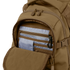 The Condor Urban Go Backpack 33L in brown is shown with its front pocket unzipped, revealing multiple blue and gray organizer compartments and a black key clip inside.
