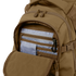 The Condor Urban Go Backpack 33L in brown is shown with its front pocket unzipped, revealing multiple blue and gray organizer compartments and a black key clip inside.