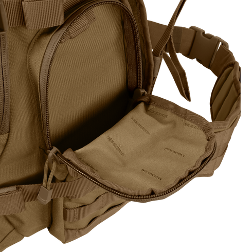 A close-up of the Condor Urban Go Backpack 33L in brown, featuring a partially open zippered front pocket that reveals its inner lining—ideal for tactical, military, or law enforcement use.
