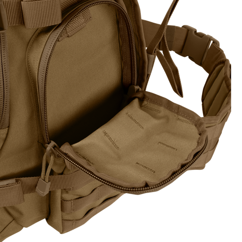 A close-up of the Condor Urban Go Backpack 33L in brown, featuring a partially open zippered front pocket that reveals its inner lining—ideal for tactical, military, or law enforcement use.