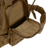 A close-up of the Condor Urban Go Backpack 33L in brown, featuring a partially open zippered front pocket that reveals its inner lining—ideal for tactical, military, or law enforcement use.