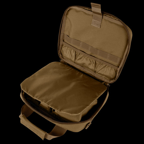 The Condor Pistol Case, shown top-down, is an open brown tactical bag with inner pockets, elastic loops, and a padded compartment—perfect for first responders or military use.