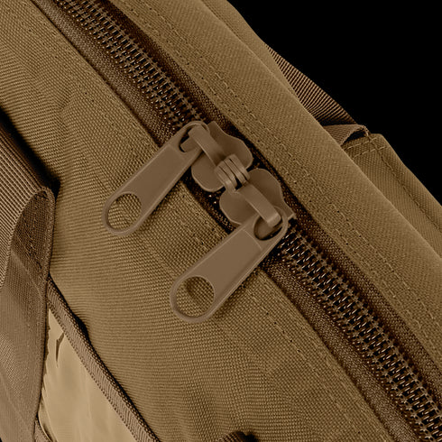 Close-up of two brown tactical zipper pulls on the Condor Pistol Case, highlighting the fabric bags zipper teeth and stitching details.