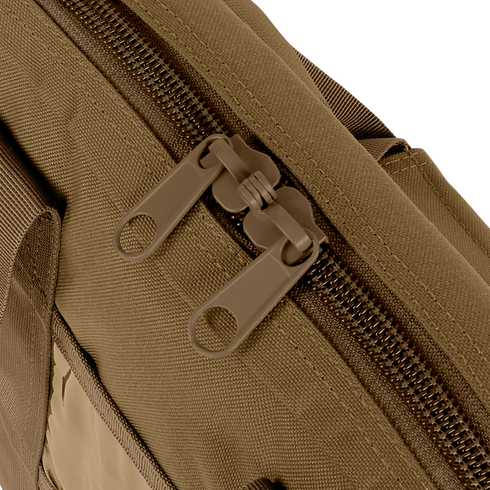 Close-up of two brown tactical zipper pulls on the Condor Pistol Case, highlighting the fabric bags zipper teeth and stitching details.
