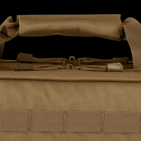 Close-up of the Condor 28 Single Rifle Case handle: brown fabric, dual zippers, sturdy stitching, and webbing loops—crafted for durability and functionality, perfect for EDC or bushcraft enthusiasts.