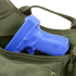 A blue plastic training gun is partially visible inside an open green Condor EDC Bag.