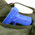 A blue plastic training gun is partially visible inside an open green Condor EDC Bag.