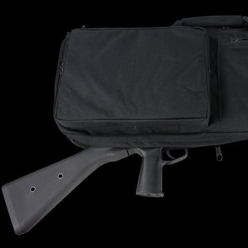 A Condor 38 Rifle Case, in black, reveals part of a rifle’s stock and grip protruding from its zippered opening.