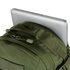 A silver laptop partially inserted into the back compartment of the Condor Venture Backpack 27.5L in Scorpion OCP, perfect for military or law enforcement professionals heading to the shooting range.