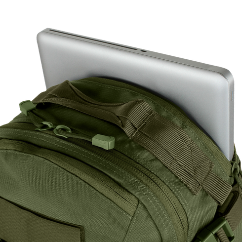 A silver laptop partly tucked into the main compartment of the Condor Venture Backpack 27.5L in olive green.