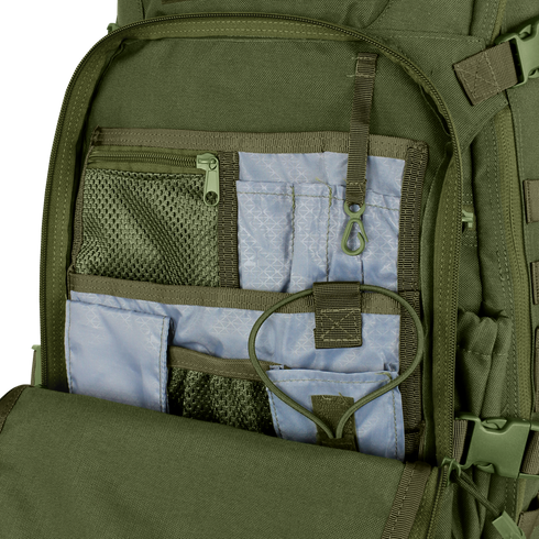 The Condor Venture Backpack 27.5L in green is shown open, revealing multiple mesh and fabric interior pockets, compartments, an elastic strap, and a plastic clip for organized storage.