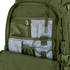 The Condor Venture Backpack 27.5L in green is shown open, revealing multiple mesh and fabric interior pockets, compartments, an elastic strap, and a plastic clip for organized storage.