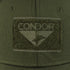 Close-up of a Condor Flex Tactical Cap - MultiCam, featuring a green fabric patch with the word CONDOR and a stylized bird logo sewn onto the olive green material.
