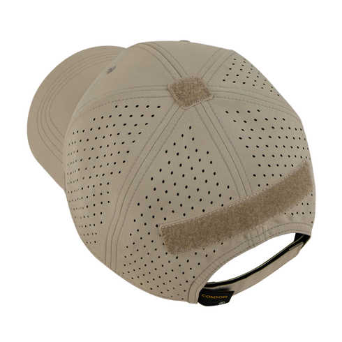 A tan baseball cap with ventilation holes, velcro patches on the top and back, and an adjustable strap.