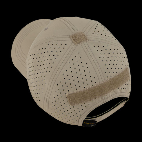 The Condor HydroFit Team Mesh Cap, in tan with rear hook-and-loop patch, is shown at an angle from the back on a wooden surface.