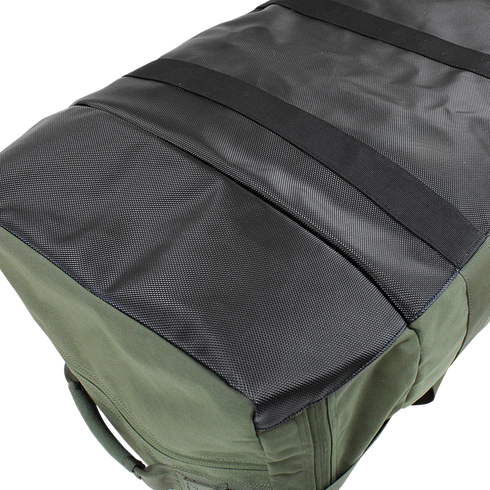 Close-up view of the Condor Centurion Duffle Bag 46L, featuring a tactical green body, textured black top panel, and horizontal webbing strips—ideal for law enforcement or first responders.