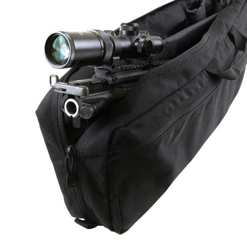 A Condor 25 Transporter Case with a rifle and mounted scope inside, perfect for bushcraft or EDC outings, is shown partially open with its black padded design.