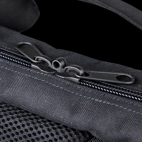 Close-up of the Condor 25 Transporter Case in black fabric, designed for shooting range or military use, featuring two zipper pulls meeting at the center of a closed zipper.