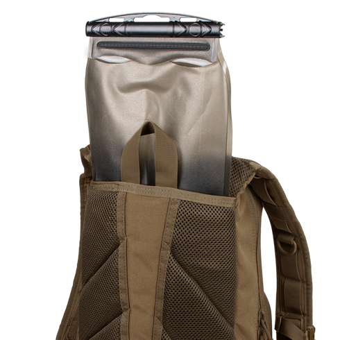 A Condor Fuel Hydration Backpack 18L in brown features a back pocket for a 3L hydration bladder, offering organized storage and easy on-the-go drinking.