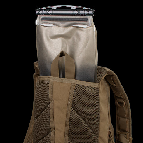 A Condor Fuel Hydration Backpack 18L in brown features a back pocket for a 3L hydration bladder, offering organized storage and easy on-the-go drinking.