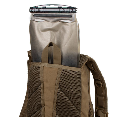 A Condor Fuel Hydration Backpack 18L in brown features a back pocket for a 3L hydration bladder, offering organized storage and easy on-the-go drinking.