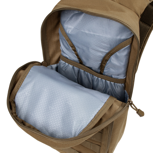 The Condor Fuel Hydration Backpack 18L in tan features a light blue interior with multiple pockets and compartments for organized gear storage.