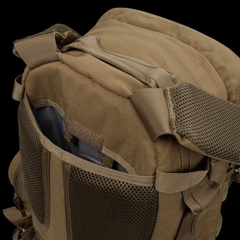 A close-up of the Condor Convoy Backpack 22L in brown, designed for EDC, featuring an open front pocket with mesh details and padded shoulder straps.